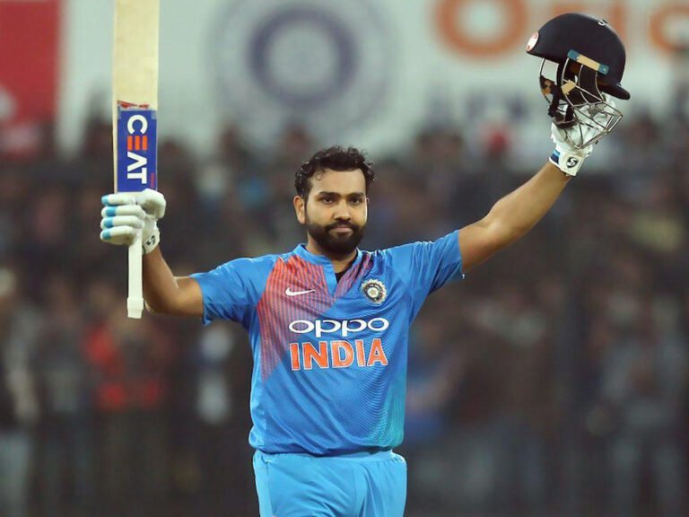 Rohit Sharma celebrating with bat and helmet showing why his cricket records may never be broken